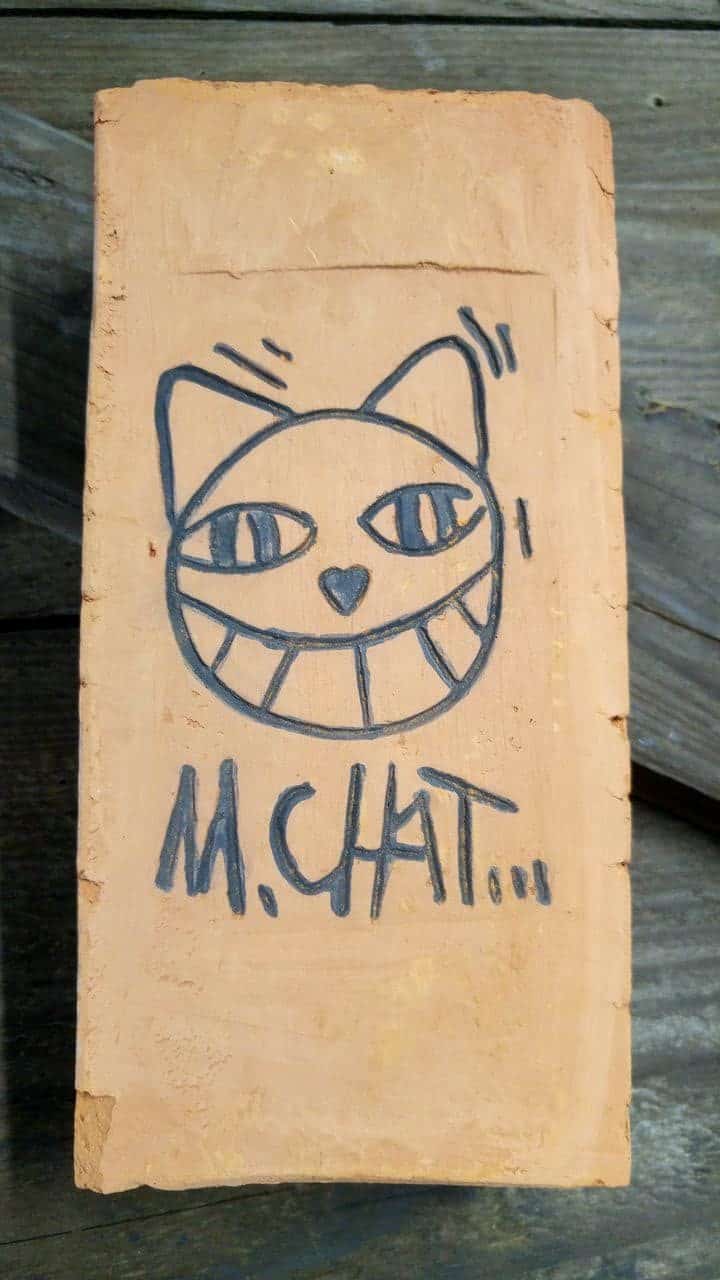 happycurio mr chat brique street art